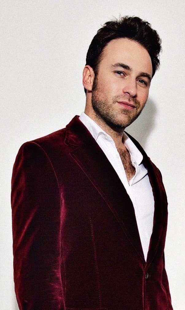 Dylan Trussell, author of The Shortcut, in a burgundy velvet jacket